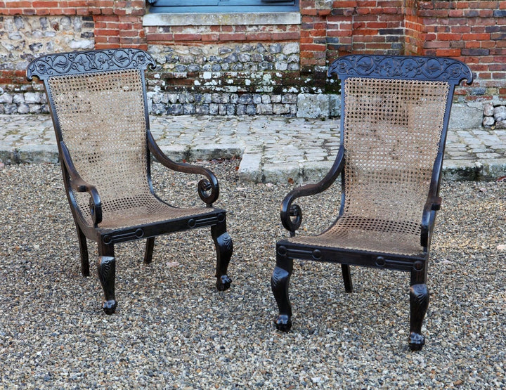Pair of 19th century Anglo Indian solid ebony caned armchairs with carved vine details by ANTIQUES