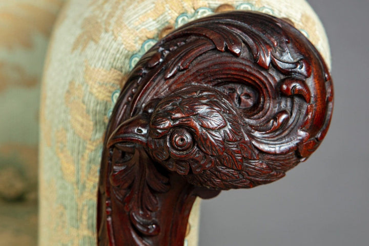Close-up of intricately carved mahogany eagle head armrest from a 19th Century library chair by Collection CK20