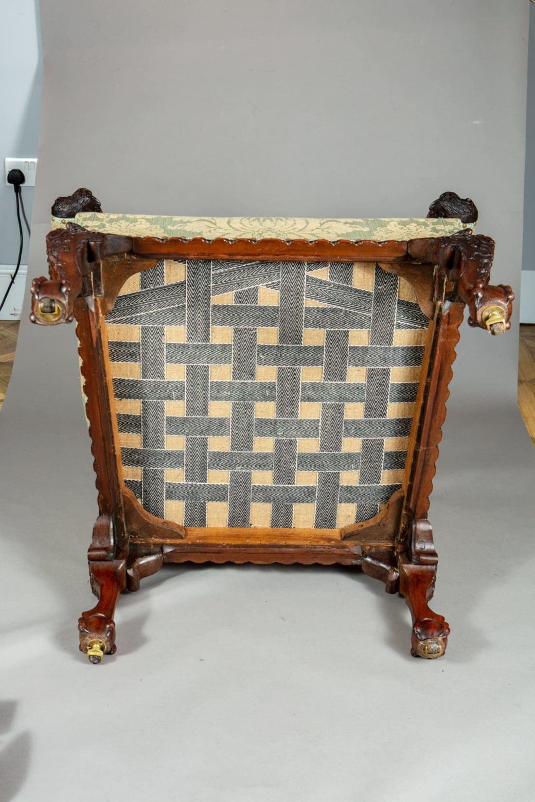 Underside view of a 19th Century mahogany library chair with woven seat support from Collection CK20