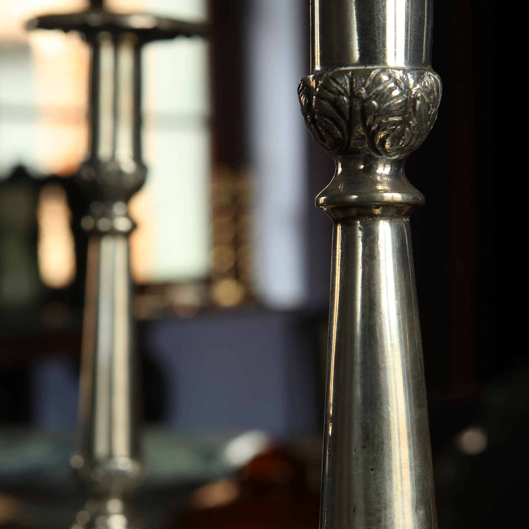 Pair of European silver candlesticks with foliate detail from Collection EE10, elegant baluster form on scroll feet