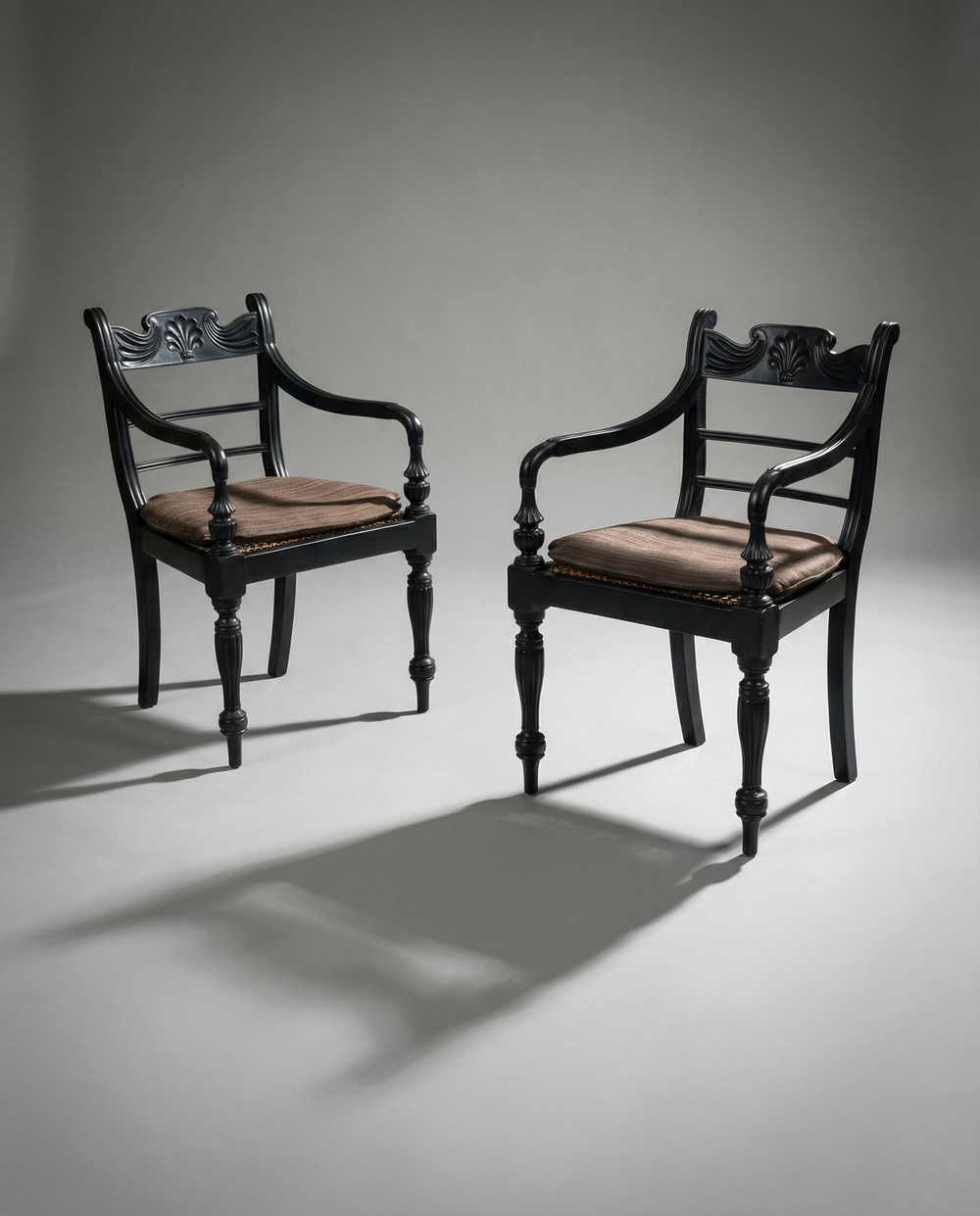 Pair of 19th century solid ebony Anglo Indian armchairs with carved back splats and cushions from Collection TH30