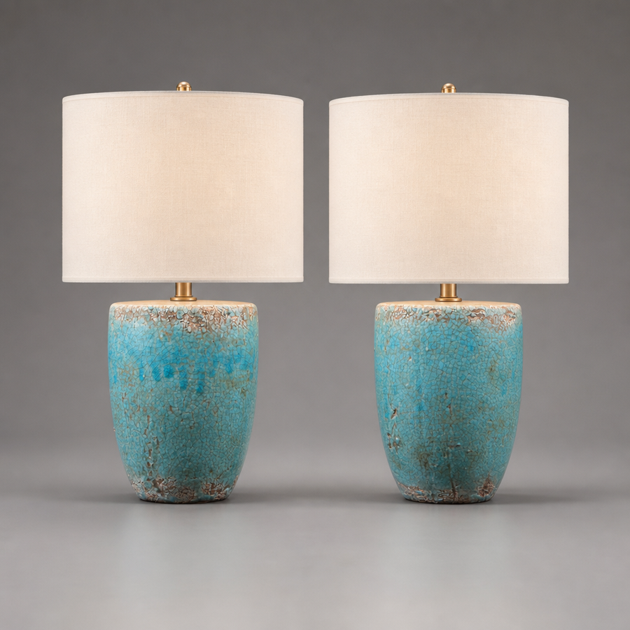 Two table lamps with turquoise bases and white shades on a gray background