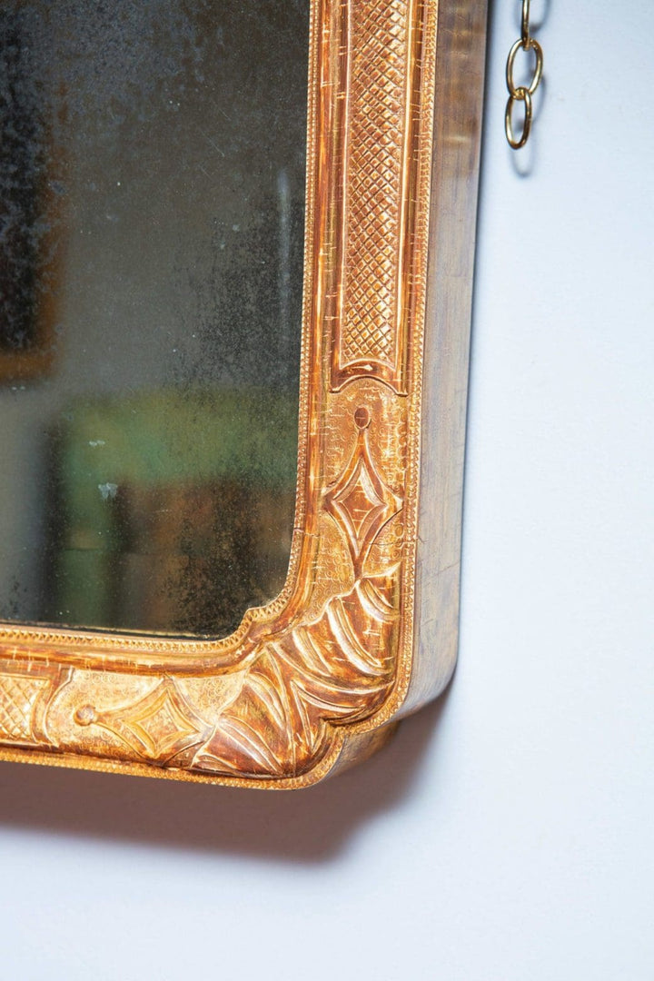 Queen Anne Overmantel Mirror with intricate carved giltwood frame and aged mercury mirror plates circa 1710 England.