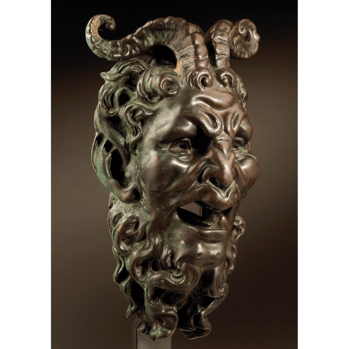 Bronze mask of a Satyr Fountain Head with detailed horns and beard, patinated bronze, mounted on a stand, Italy circa 1800.