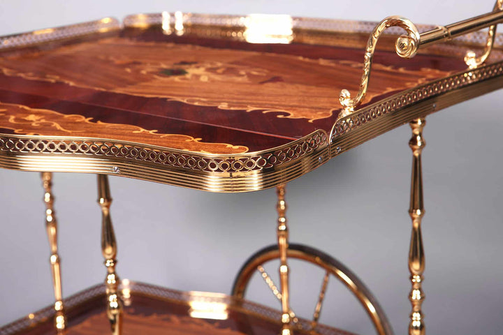 Close-up of a Nicholas Wells Antiques mid-century Italian marquetry drinks trolley with brass details and intricate wood inlay