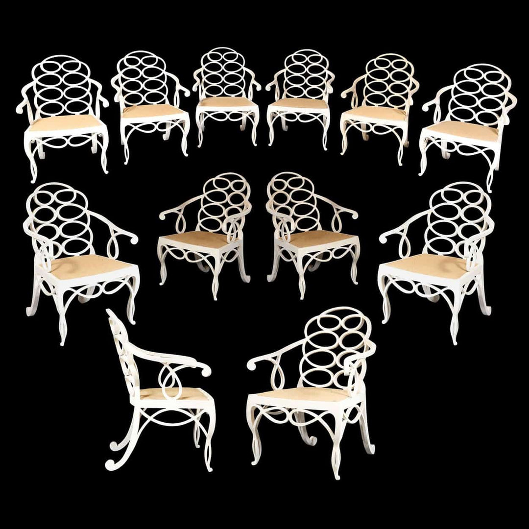 Set of twelve matt white Loop Chairs with elegant hoop back design and wood seats, Collection EE30 on black background