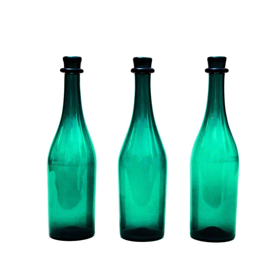 Three hand blown green bottles from England circa 1830 available at The Sold Archive