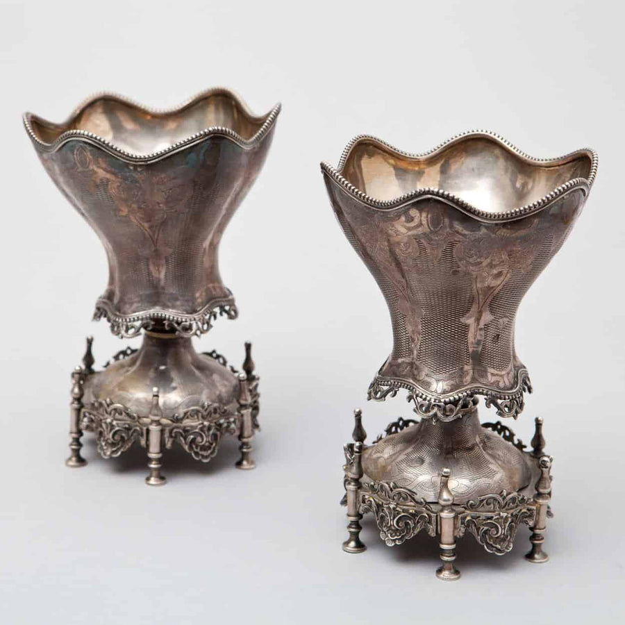 A pair of 19th century Ottoman silver spoon warmers with scalloped edges on ornate six-footed bases by The Sold Archive