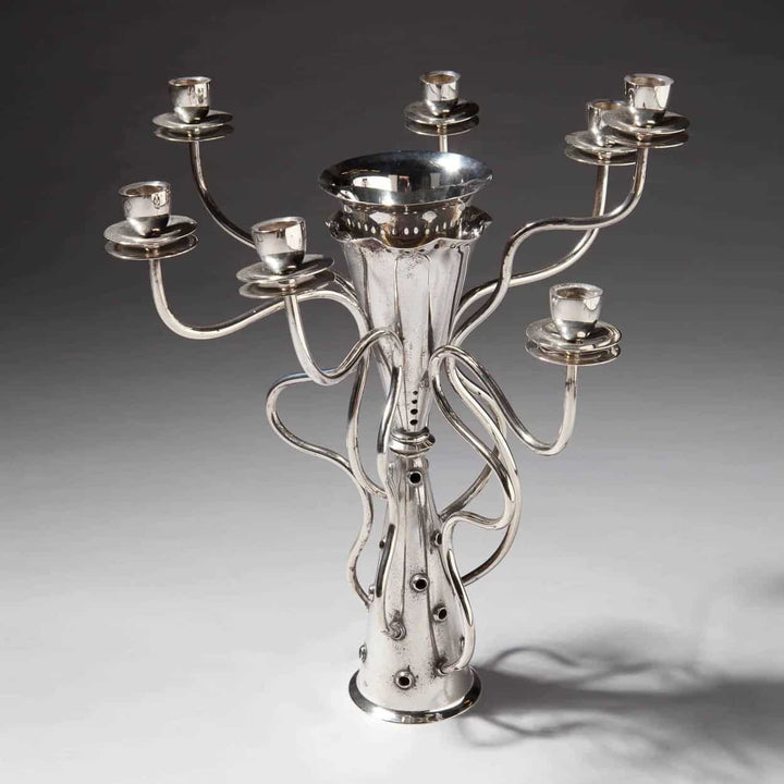 Silver plate candelabrum by Borek Sipek with intricate flowing arms from Collection TH10 on neutral background