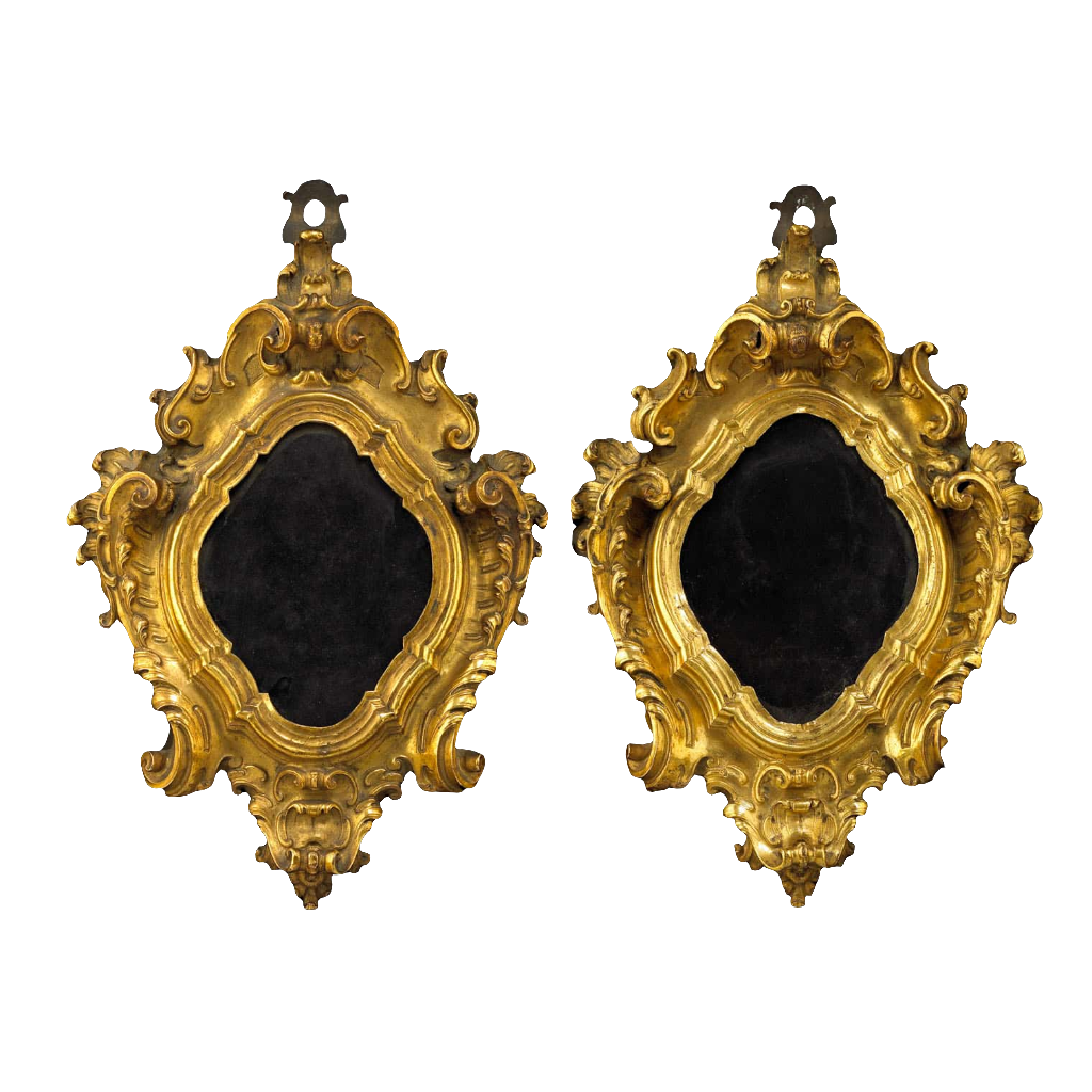 A pair of 17th century Italian gilt bronze baroque picture frames by Nwtiques with ornate scroll details