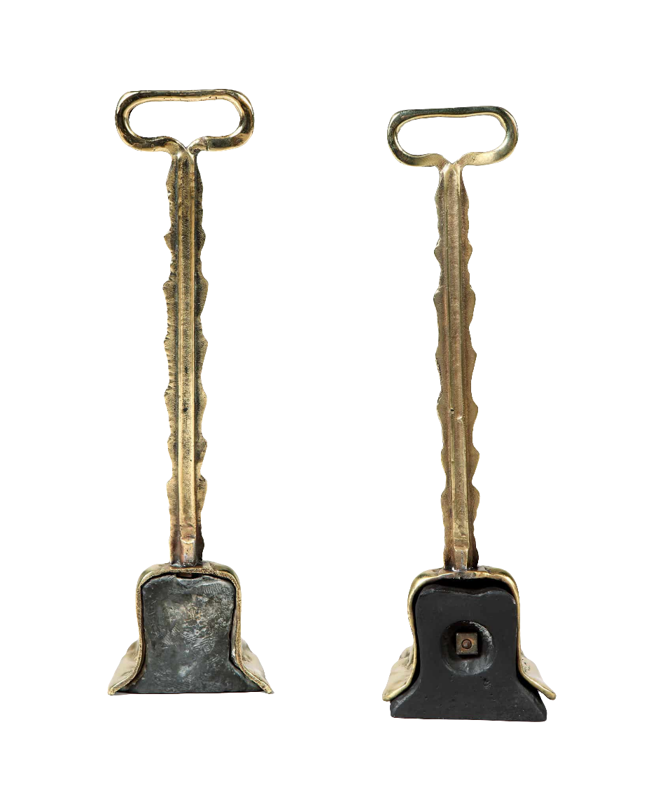 Pair of 19th century weighted brass door porters by Collection TH10 with intricate Victorian design and functional detail
