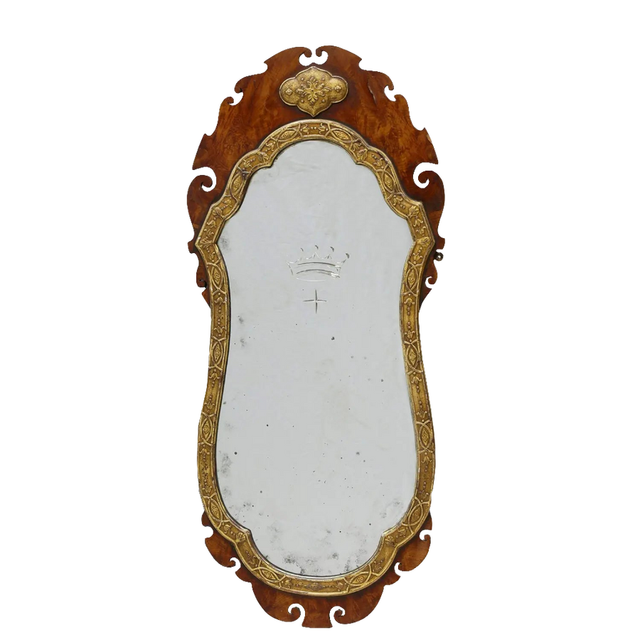 A George III flame veneered mahogany wall mirror with gilt gesso frame and engraved coronet and star, circa 1770.