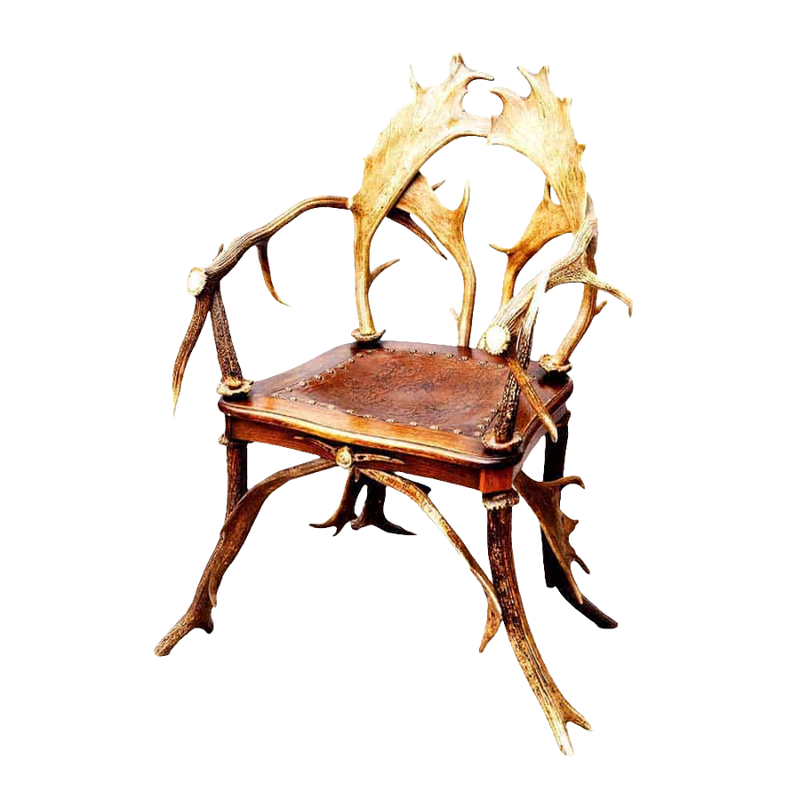 Victorian Black Forest antler armchair from Nwtiques with intricately carved antler frame and leather seat