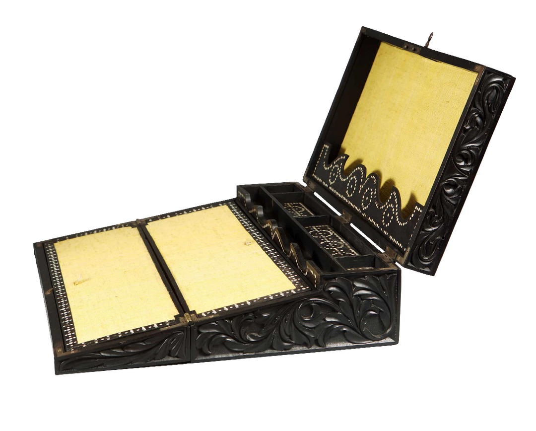 Mid-19th century Anglo Ceylonese ebony writing slope with intricate carvings, by Nicholas Wells Antiques.