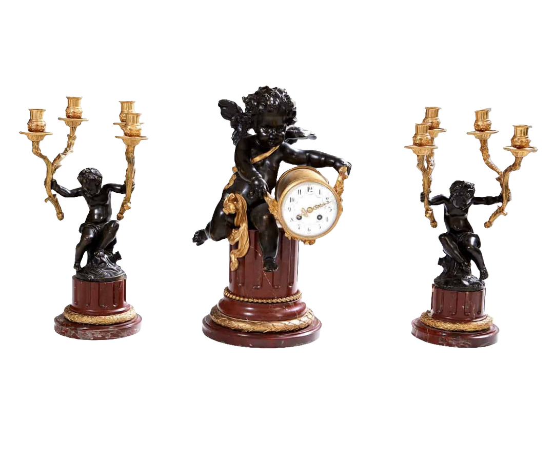Gilt bronze and marble clock garniture with cherub and candelabra by Nwtiques circa 1870 France