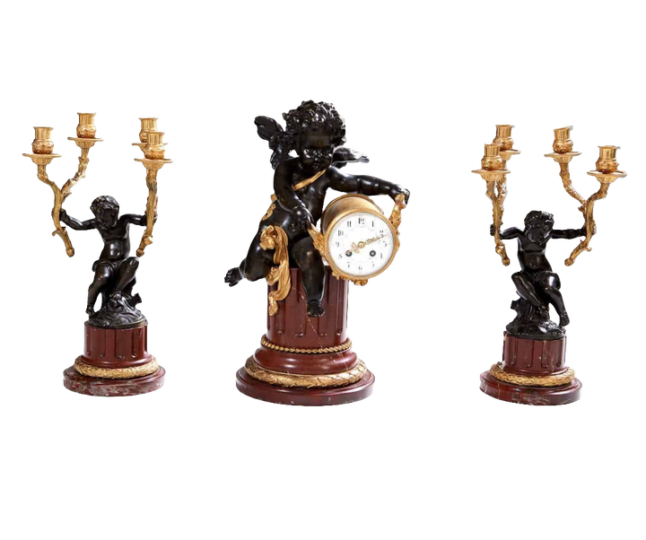 Gilt bronze and marble clock garniture with cherub and candelabra by Nwtiques circa 1870 France