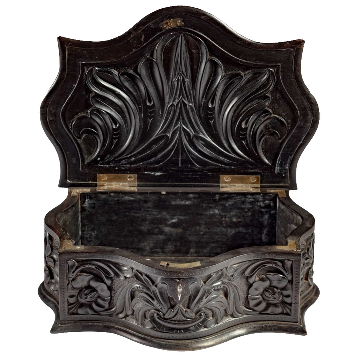 Mid 19th century carved ebony workbox with floral relief by Nwtiques, open showing interior details