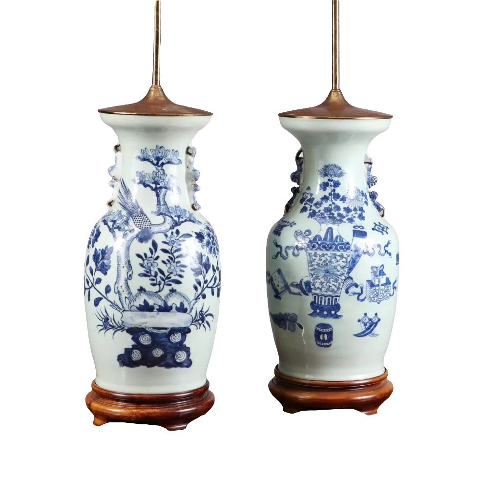 Chinese Blue and white table lamps featuring birds and vases motifs on porcelain with wooden bases, circa 1950.