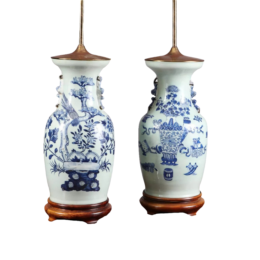 Chinese Blue and white table lamps featuring birds and vases motifs on porcelain with wooden bases, circa 1950.