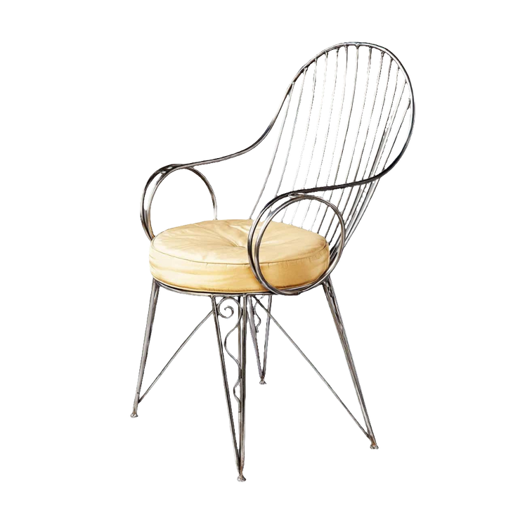 Modernist steel desk chair with curved armrests and beige cushion from Collection TH20, featuring vintage industrial elegance.