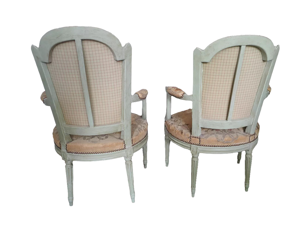 Pair of late 18th century Louis XVI fauteuils with original needlework seats, from Nwtiques.