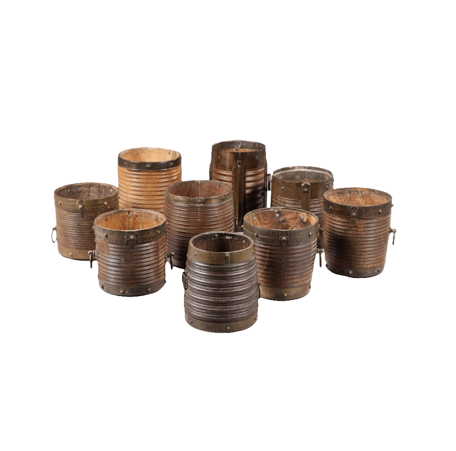 Collection EE20 of nine 19th century Indian teak rice measures with brass bindings and ribbed turned bodies