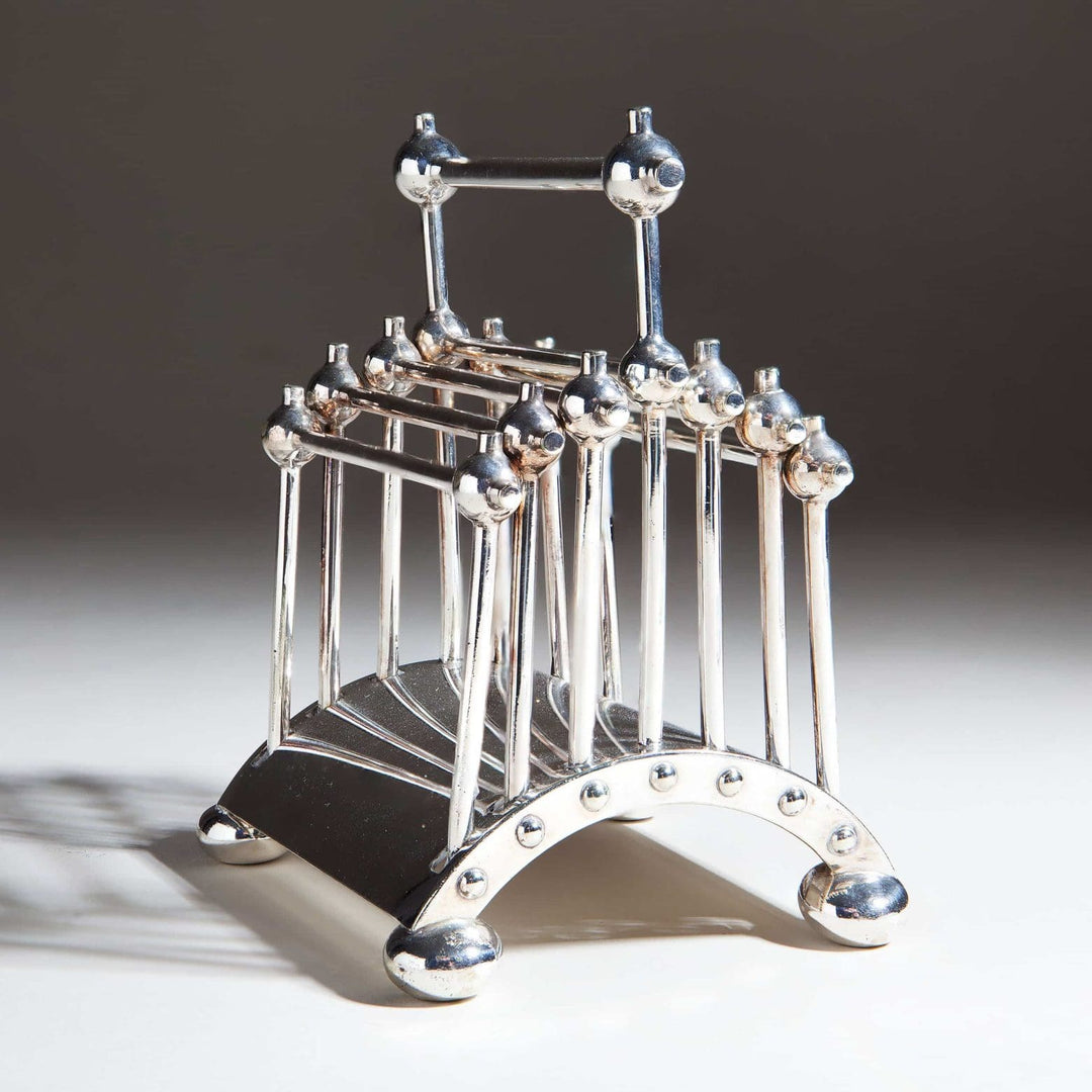 Hukin And Heath articulated silver letter rack by Nwtiques, designed by Dr. Christopher Dresser circa 1880.
