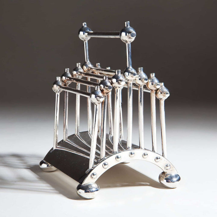 Hukin And Heath articulated silver letter rack by Nwtiques, designed by Dr. Christopher Dresser circa 1880.