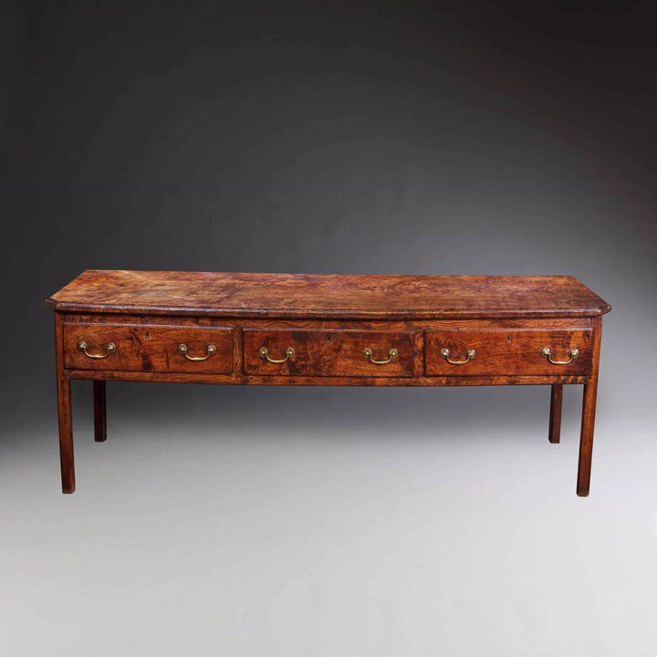 Magnificent mid-18th century Welsh elm dresser base with drawers from Collection CK20, featuring rich patina and classic design.
