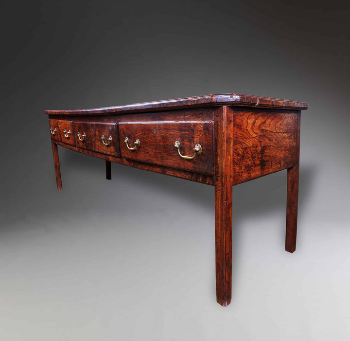 Magnificent mid-18th century Welsh elm dresser base by Collection CK20 with elegant drawers and rich patina.