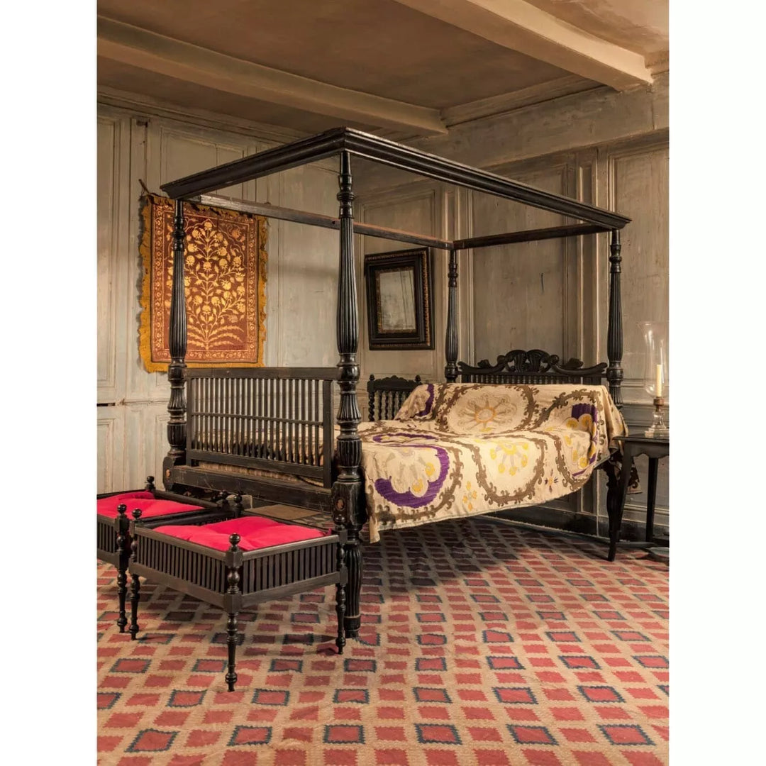 Mid-19th century Anglo-Indian ebony four-poster bed by Collection EE20 with carved details and vibrant upholstery