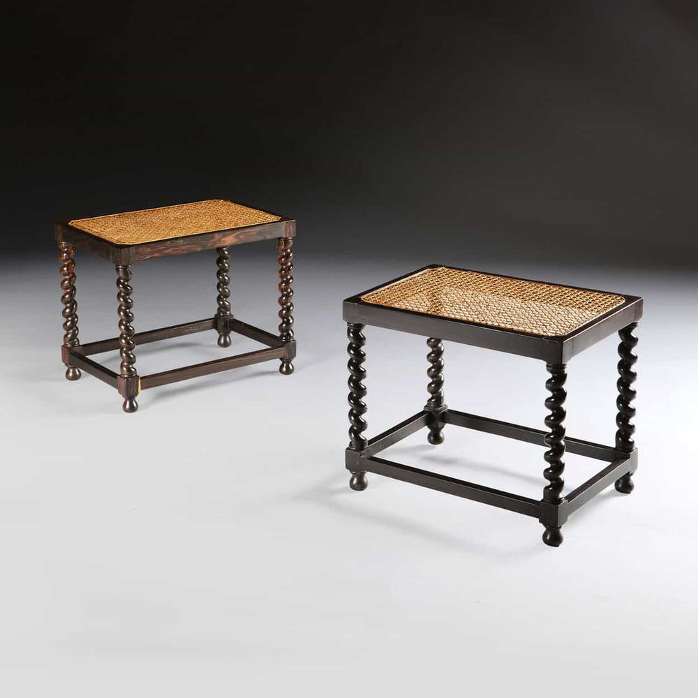 Pair of handmade solid ebony barley twist stools with caned seats by Collection EE30 in a traditional design