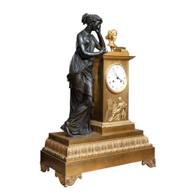 Empire ormolu and bronze mantel clock by The Sold Archive featuring a figure leaning on a detailed clock case circa 1825