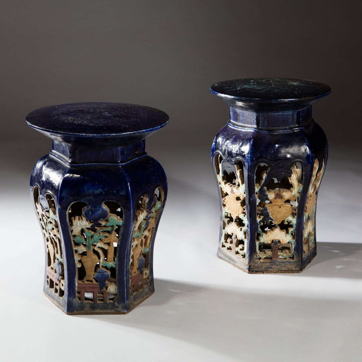 Pair of blue glazed Chinese pottery garden seats with intricate cut-out designs Collection EE30