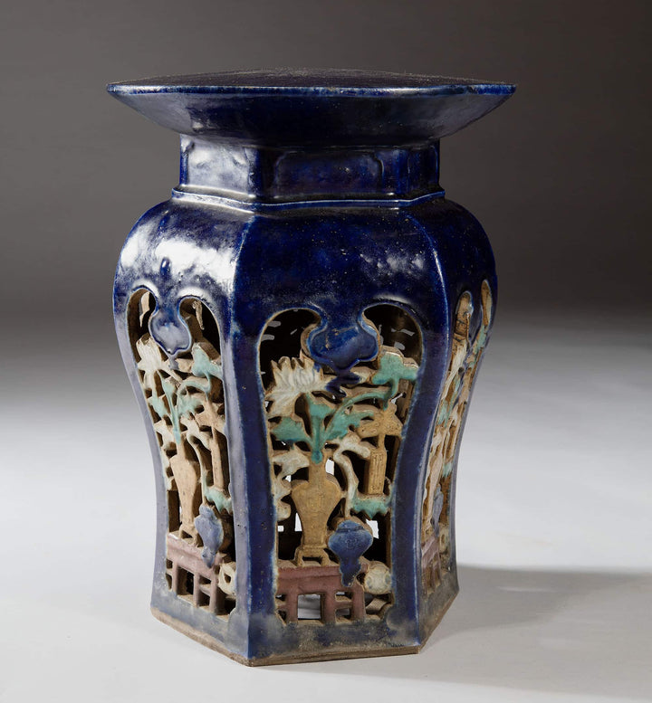 Pair of blue glazed Chinese pottery garden seats with carved floral designs from Collection EE30