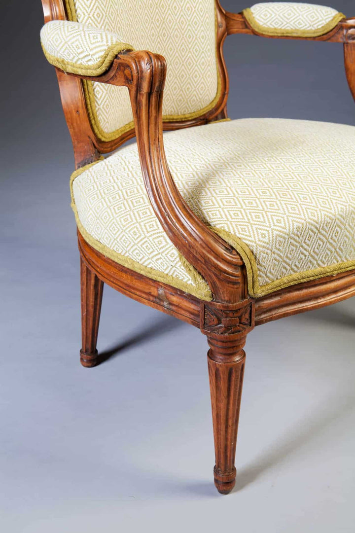 Close-up of an 18th century Louis XV transitional fauteuil with patterned upholstery by Nwtiques