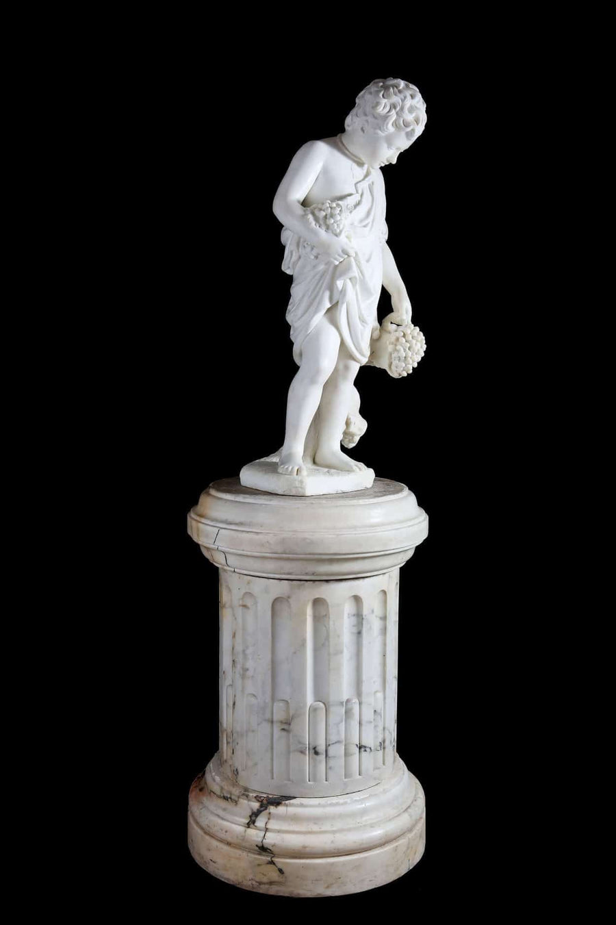 19th century carved marble sculpture of young Bacchus on fluted pedestal by Professore Giuseppe Lazzerini from The Sold Archive