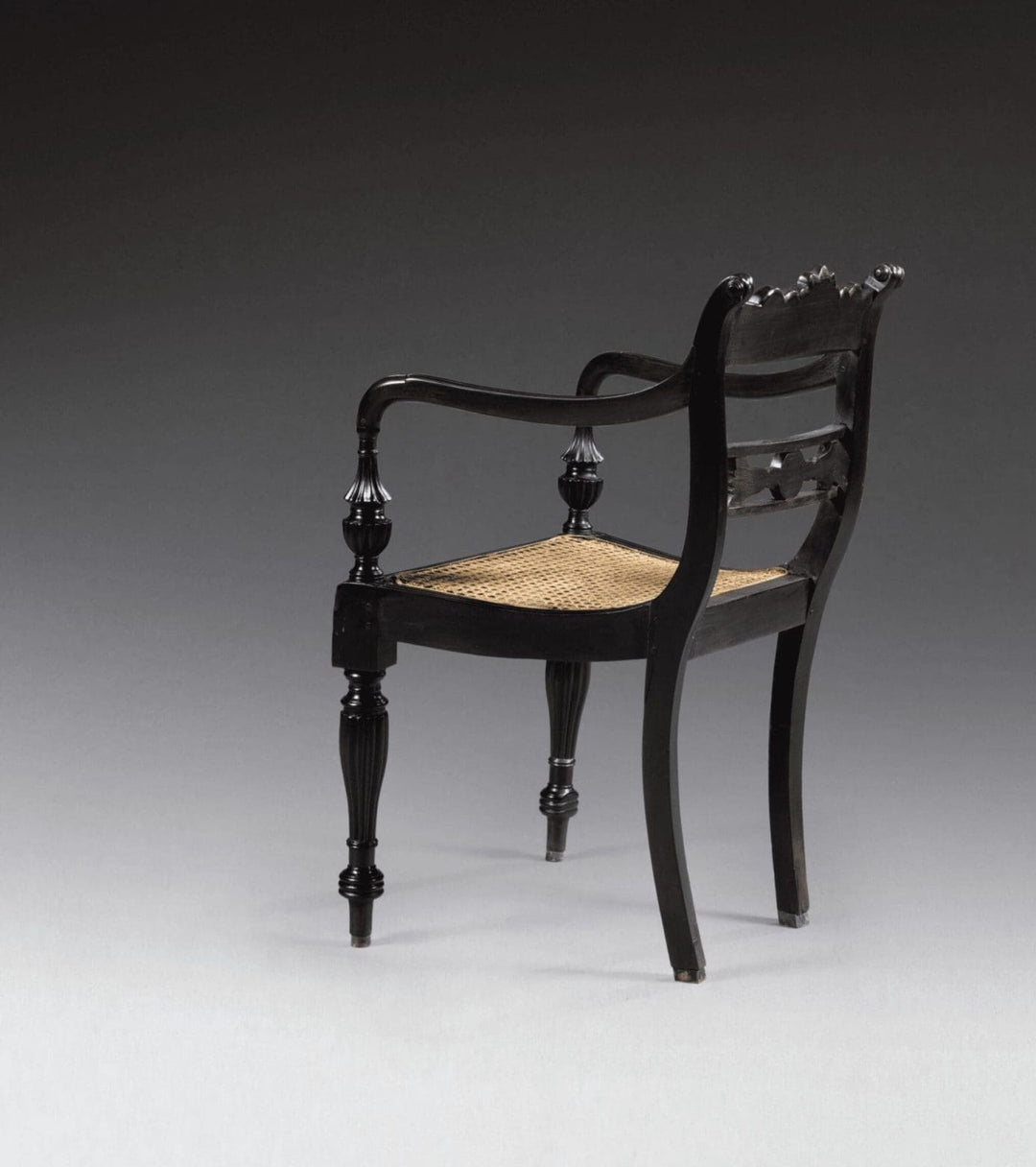 Mid-19th century Anglo-Indian ebony armchair with cane seat and carved details from Collection EE30.