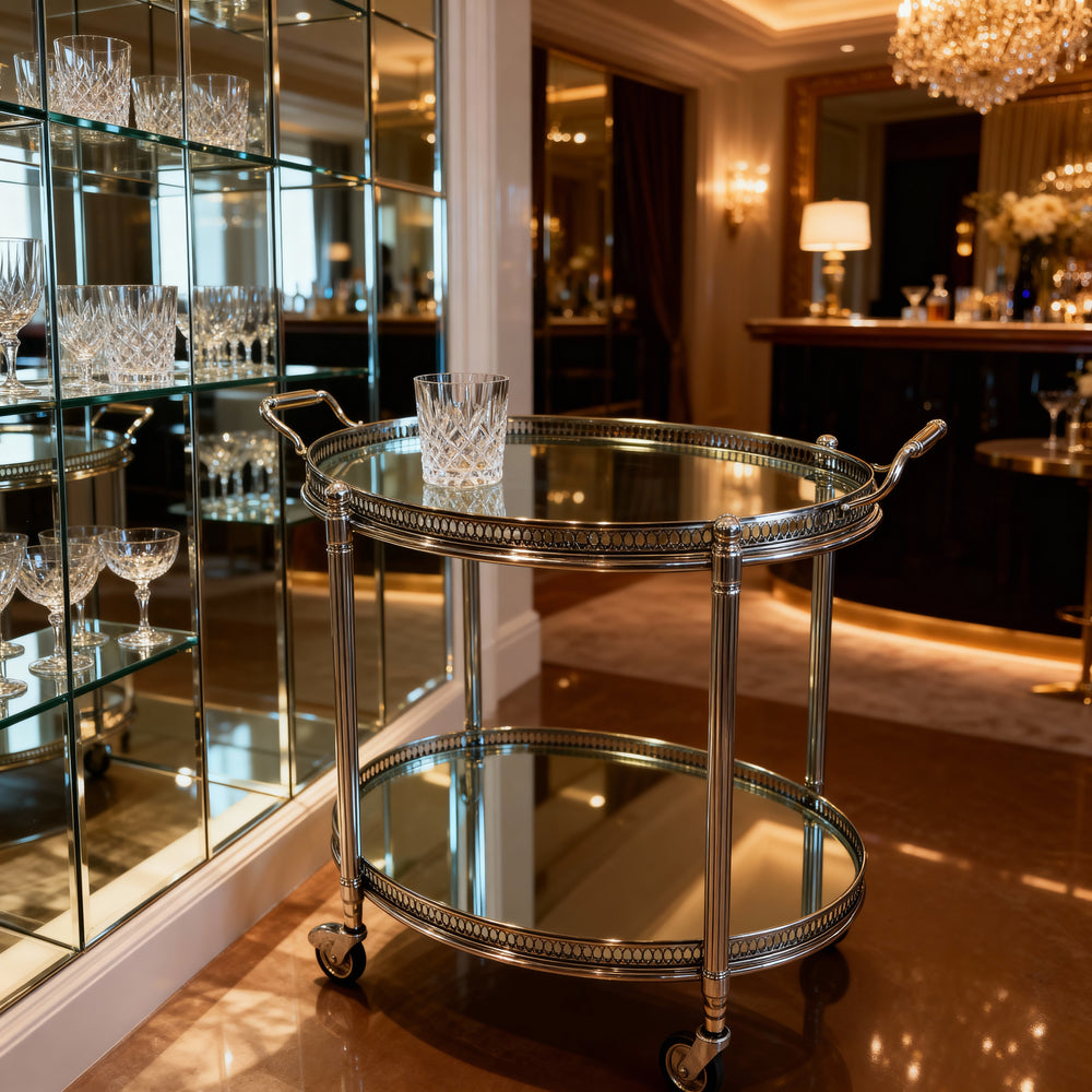Vintage Maison Jansen drinks trolley in silvered brass with glass shelves by Nwtiques in elegant room setting